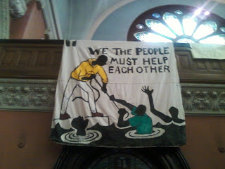 Signs and literature on mutual aid at 520 Clinton Ave. 
