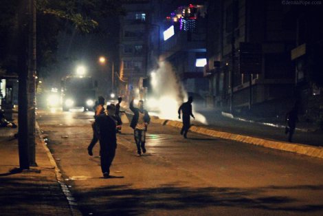 A water cannon truck attempts to disperse protestors.