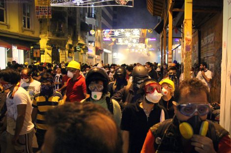 Tear gas floating down the street towards protestors as they are pushed further from the square.