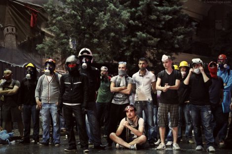 Protestors standing in front of a water cannon truck just moments before it began spraying them.