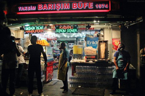 Workers at a restaurant near Taksim Square wearing gas masks.